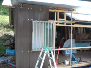 Putting on the outer siding and a recycled window