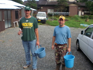 Chris and Norman do garden duty, picking green beans.