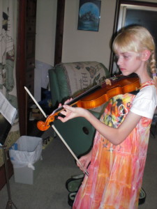 Melodie begins violin lessons